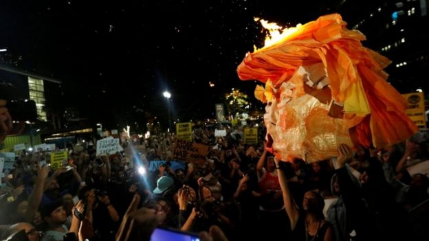 Protesters carry a Trump effigy in Los Angeles