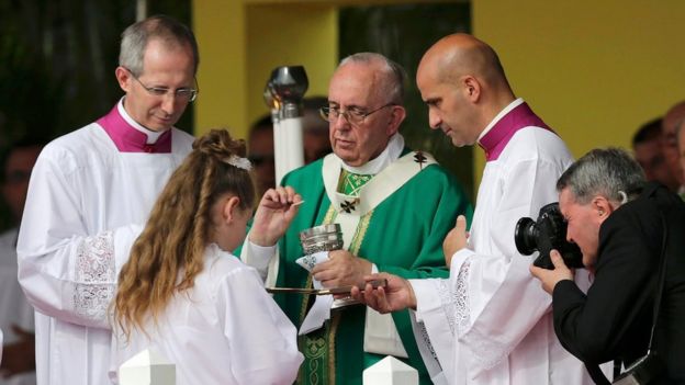 Pope Francis gives Communion at the end of the first mass of his visit to Cuba in Havana