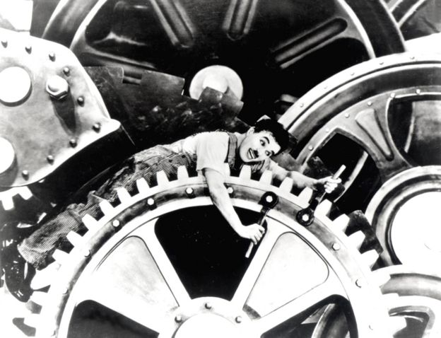 Charlie Chaplin getting trapped in a machine