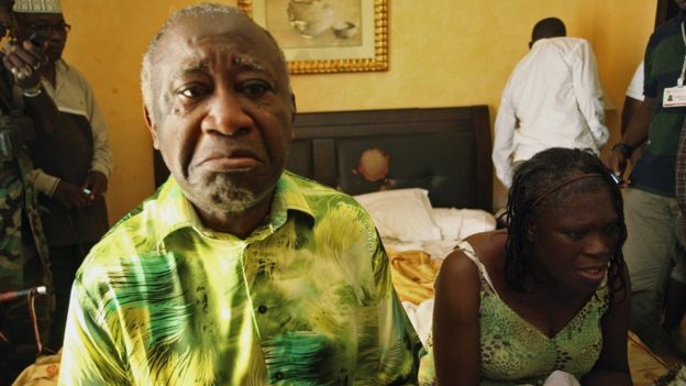 Laurent and Simone Gbagbo sit in a hotel room after their arrest