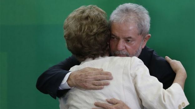 Brazil's former president, Luiz Inacio Lula da Silva hugs Brazil President Dilma Rousseff as he is sworn in as the new chief of staff in the Planalto Palace on March 17, 2016 in Brasilia, Brazil.
