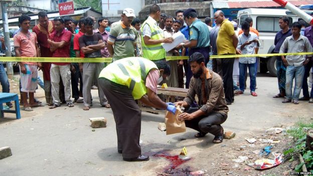 A police officer investigates at the spot where Bangladeshi blogger Ananta Bijoy Das was killed, in Nurani area of Sylhet, Bangladesh, 12 May 2015.