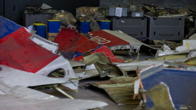 Parts of the wreckage of the Malaysia Airlines Flight 17 are displayed in a hangar at Gilze-Rijen airbase, Netherlands (March 2015)