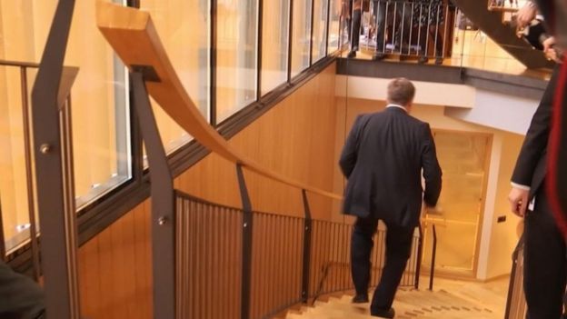Screengrab taken from video showing Iceland's Prime Minister Sigmundur Gunnlaugsson walking down stairs after a meeting in parliament (5 April 2016)