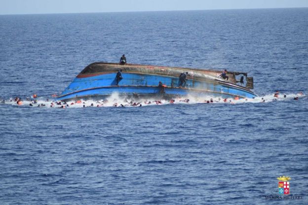 Migrants cling to a capsizing boat in the Mediterranean, 25 May