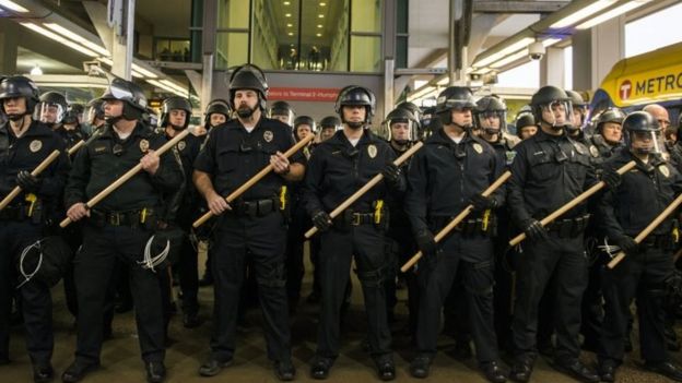 Police at the Minneapolis-St Paul International airport, where a number of Black Lives Matter protesters attempted to enter the premises