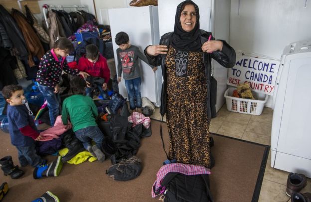 Syrian Refugee Sawsan Al Jasem, looks on as her children get ready to go outside inside their temporary home in Picton, Ontario, Canada, Wednesday January 20, 2016.