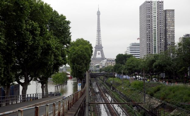 Water floods train tracks in Paris, France Saturday June 4, 2016.