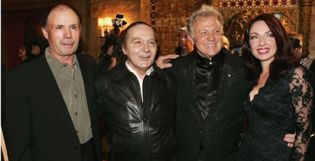 Snowy Fleet and Stevie Wright of The Easybeats, alongside singer Normie Rowe and his wife Jennifer Foote at an award ceremony in 2005