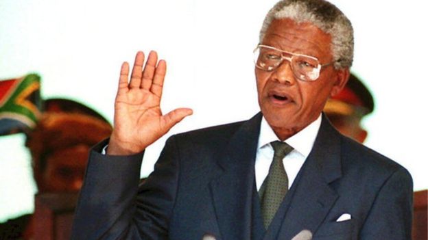 Nelson Mandela taking the presidential oath in 1994