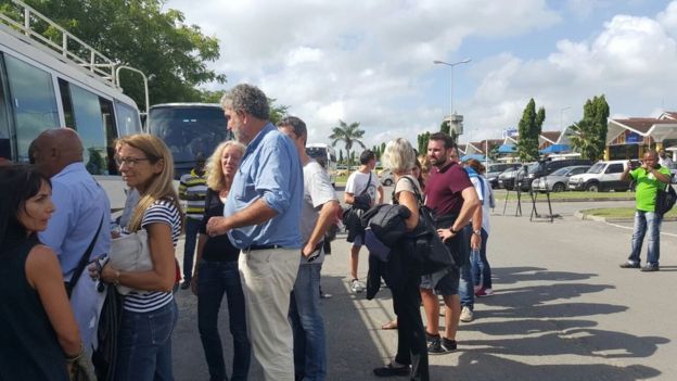 Passengers from Air France flight queue for a bus