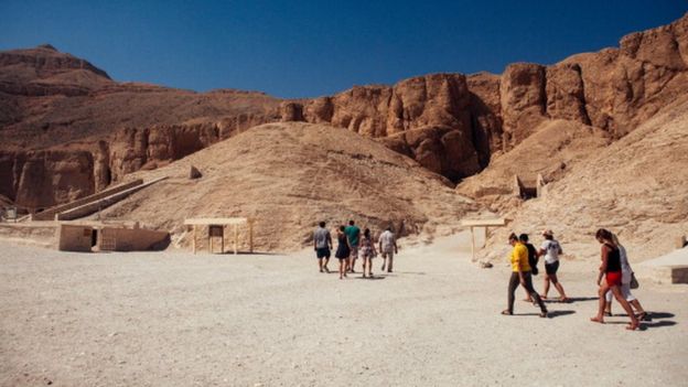 Tourists walk toward the entrance to a tomb in The Valley of the Kings in Luxor (file photo)