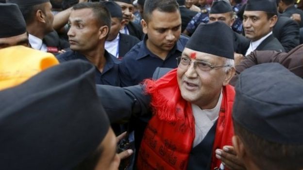 Nepal's newly-appointed prime minister Khadga Prasad Oli (centre) is surrounded by supporters at the Constituent Assembly in Kathmandu (11 October 2015)