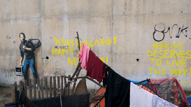 Banksy artwork at the Jungle refugee camp showing Steve Jobs