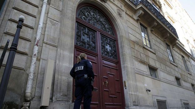 Police stand guard at entrance of luxury residence on Rue Tronchet in Paris, where masked men robbed reality TV star Kim Kardashian West. 3 October 2016