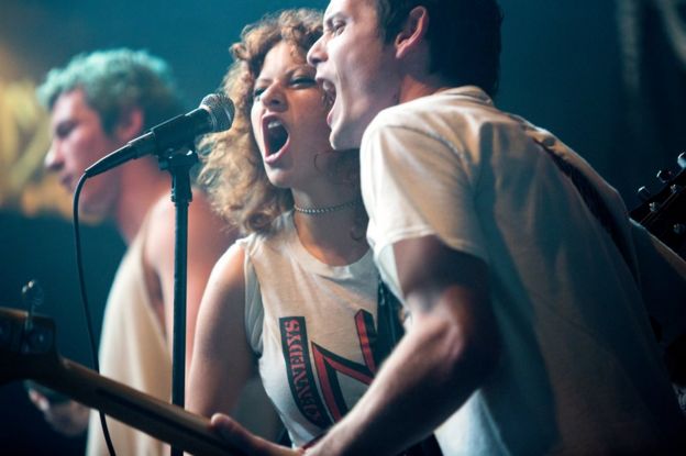 This image released by A24 Films shows Alia Shawkat and Anton Yelchin, right, in a scene from, Green Room