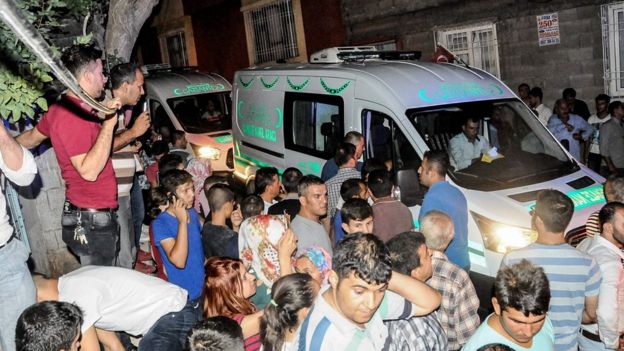 People gather near the explosion site on August 20, 2016 in Gaziantep following a late night militant attack on a wedding party in south-eastern Turkey.