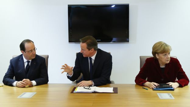 France's President Francois Hollande, Britain's Prime Minister David Cameron and Germany's Chancellor Angela Merkel speak during a meeting to discuss the situation in Ukraine at the European Union Council Building on March 6, 2014 in Brussels