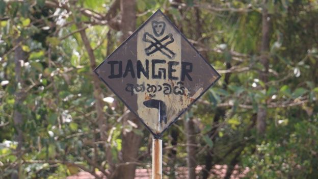 Villagers have erected a sign warning people to avoid the school