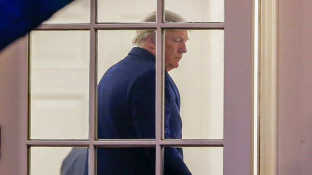 US President Donald Trump enters the Oval Office of the White House after returning from a weekend at his Palm Beach, Florida, Mar-a-Lago club, 5 March 2017