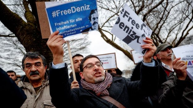 Protesters shout slogans in front of the Turkish Consulate as a protest against the visit of Turkish Foreign Minister Mevlut Cavusoglu in Hamburg, Germany, 7 March 2017