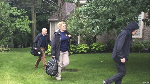 FBI investigators search the house of Subway sandwich chain pitchman Jared Fogle in Zionsville, Indiana on 7 July 2015