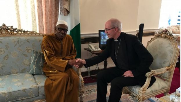 Archbishop of Canterbury Justin Welby sits with Nigeria's P in Abuja House, London, 9 March 2017.