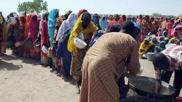 People lining up for food at a camp in Borno State for those who have fled their homes, Nigeria