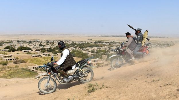 Anti-Taliban Afghan fighters on patrol in Faryab, one of the least secure Afghan provinces rife with crime and insurgent activity