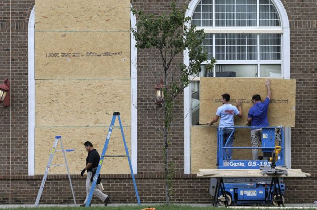 Men repair windows in Charlotte