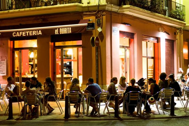 Customers drinking outside a bar in Spain