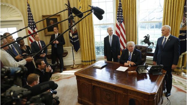 President Trump talks to reporters in the Oval Office