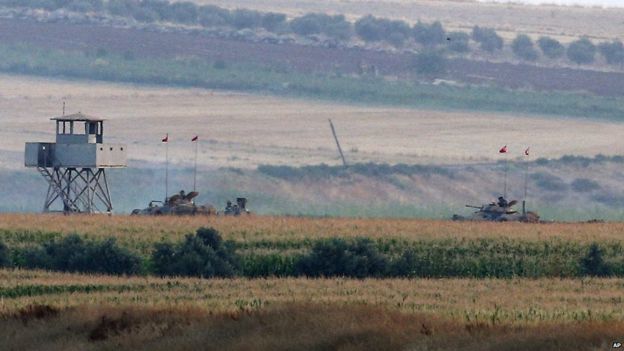The Turkish army holds positions near the Syrian border