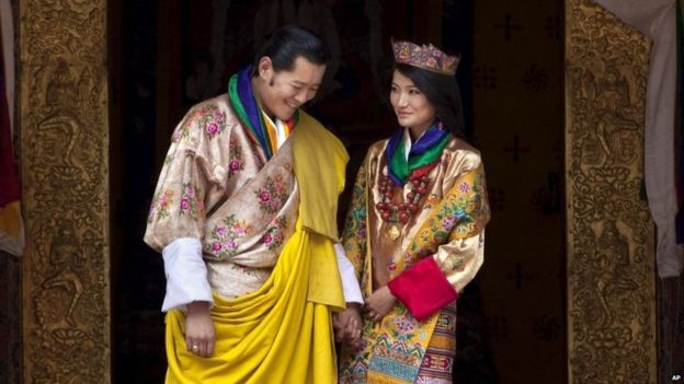 This Oct. 13, 2011 file photo Queen Jetsun Pema, right, looks at King Jigme Khesar Namgyal Wangchuck as they pose after they were married