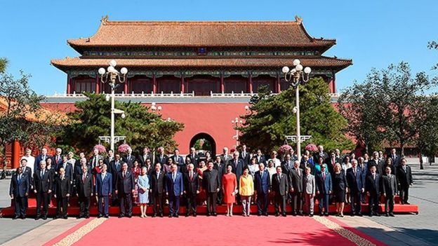 Kolya and Alexander Lukashenko pose for a photo with leaders at Beijing's WW2 commemorations