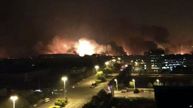 Smoke and fire erupt into the night sky after an explosion in the Binhai area, photo released by Xinhua 12/08/2015