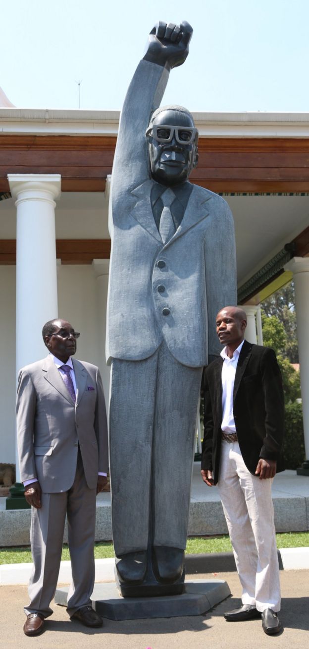 Robert Mugabe, left, sculpture of himself, centre and Dominic Benhura, right