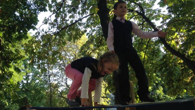 Olga Makarenkos son and daughter play at a park in Ukraine, September 2015