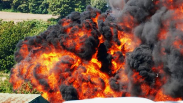 Flames from the crash Hawker Hunter jet