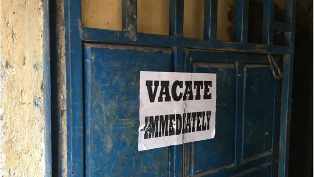 Vacate Immediately sign on door of house to be demolished in Harama, Nairobi, 6 May 2016