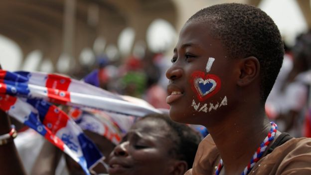 A supporter of Ghana's new president Nana Akufo-Addo with her face painted at his inauguration in Independence Square Accra, 7 January 2017