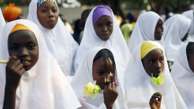 Children wait for the arrival of Pope Francis on the occasion of his visit at the Central Mosque in Bangui