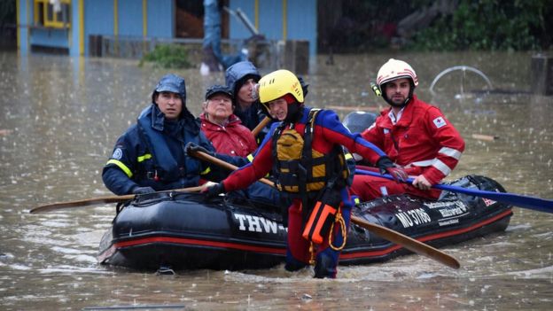 Staff of the Bavarian Red Cross and the German Federal Agency for Technical Relief (THW) evacuate people in Simbach, Germany, 1 June 2016.