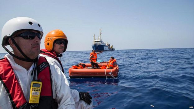 An image published online by Medecins sans Frontieres of rescuers and rescued migrants - 5 August 2015