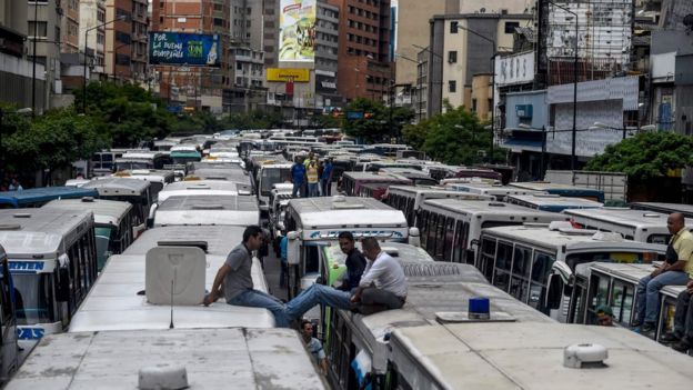 Street in Caracas blocked by buses during a protest by drivers due to the shortage of spare parts for their vehicles on 21 September