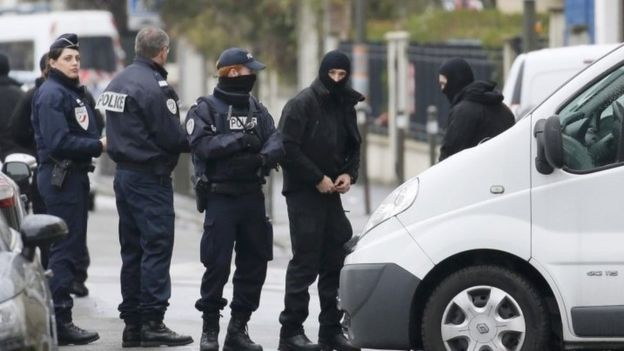 Police near the apartment raided in Argenteuil, Paris, 25 March 2016