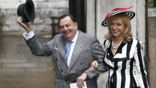 Barry Humphries and his wife Lizzie Spender pose for a photograph as they arrive at St Bride