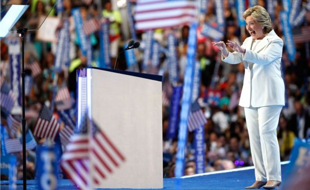 Democratic presidential candidate Hillary Clinton acknowledges the crowd as she arrives on stage during the fourth day of the Democratic National Convention at the Wells Fargo Center, 28 July 2016 in Philadelphia.