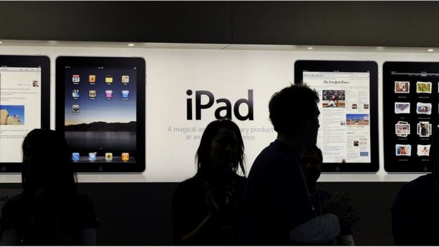 Staff members prepare for the Australian launch of the iPad inside Apple's flagship store in Sydney
