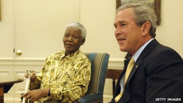 US President George W Bush (R) meets Nelson Mandela in the Oval Office of the White House in Washington DC on 17 May 2005